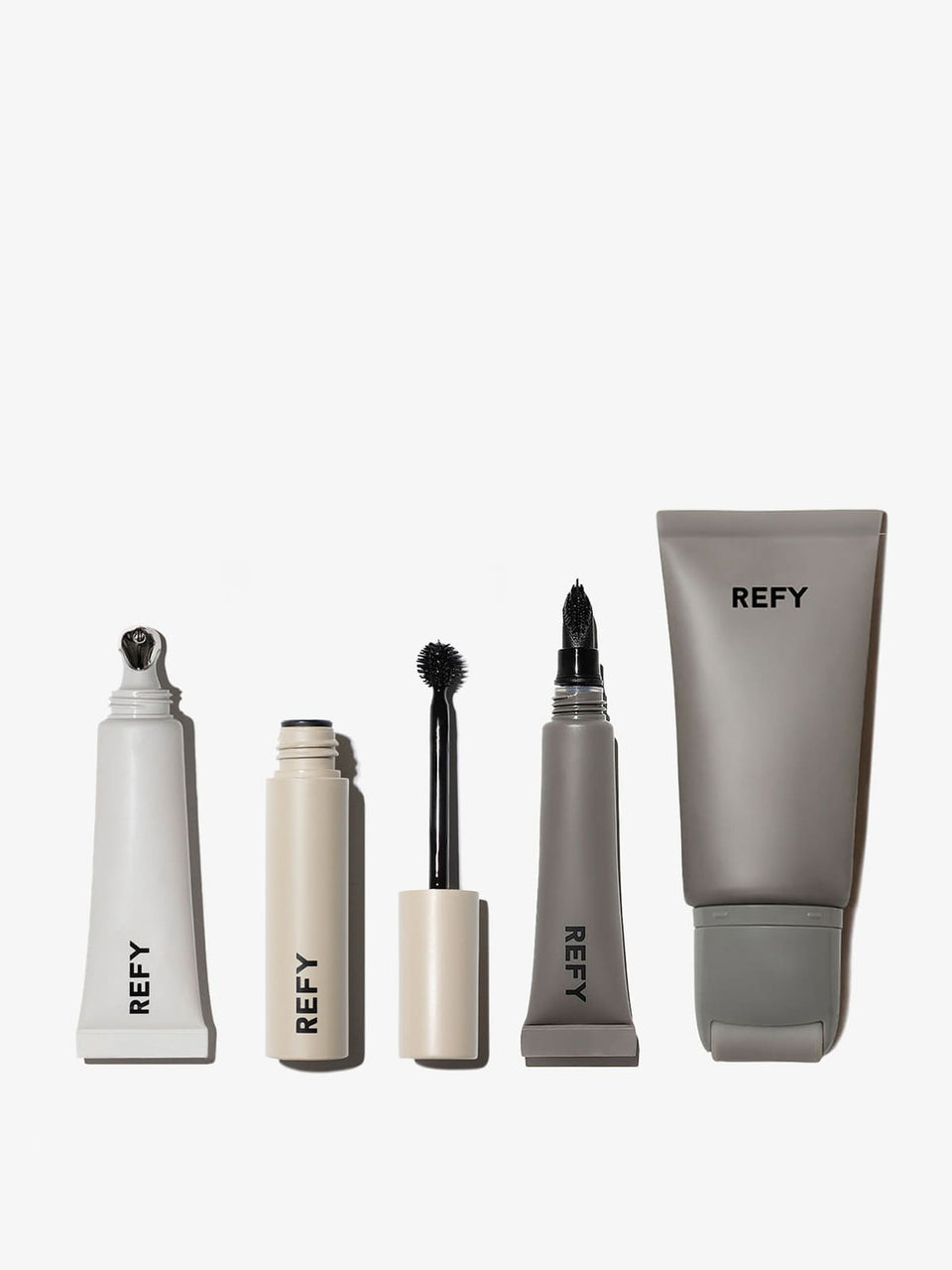 FRONT IMAGE OF REFY EVERYDAY ESSENTIALS SET. CONTAINS LIP GLOSS IN CLEAR, BROW TINT, LIP BUFF + FACE PRIMER