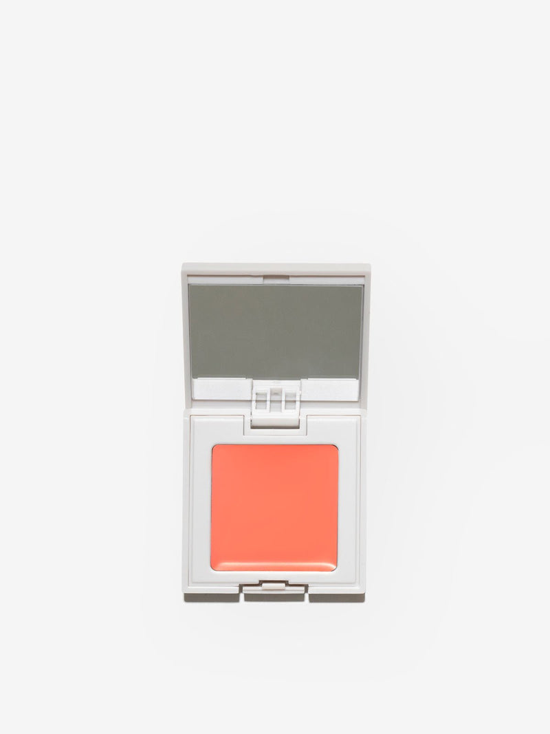FRONT IMAGE OF REFY CREAM BLUSH IN SHADE PEACH. MIX OF PINK AND ORANGE WITH WARM UNDERTONES